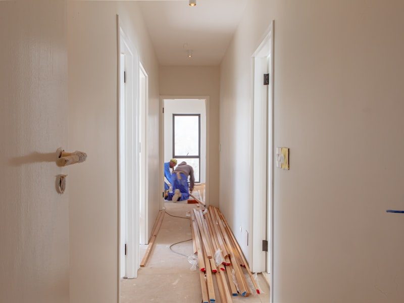 Home renovation with new flooring being installed in a hallway