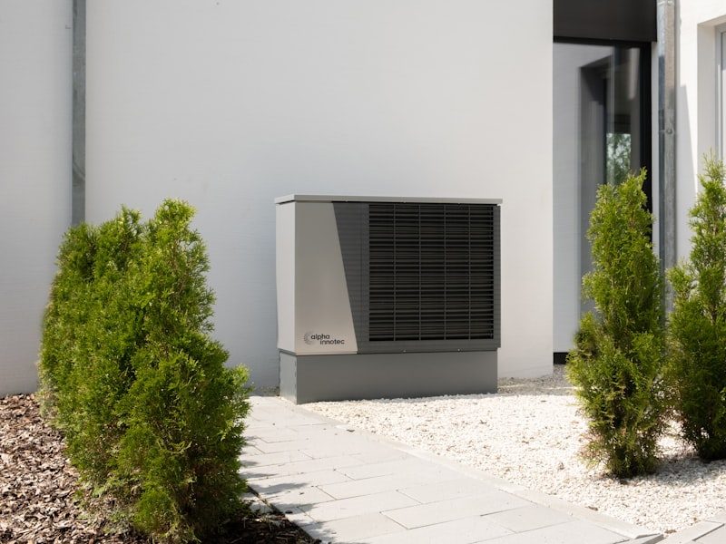 Heat pump and air conditioning unit installed outside a home